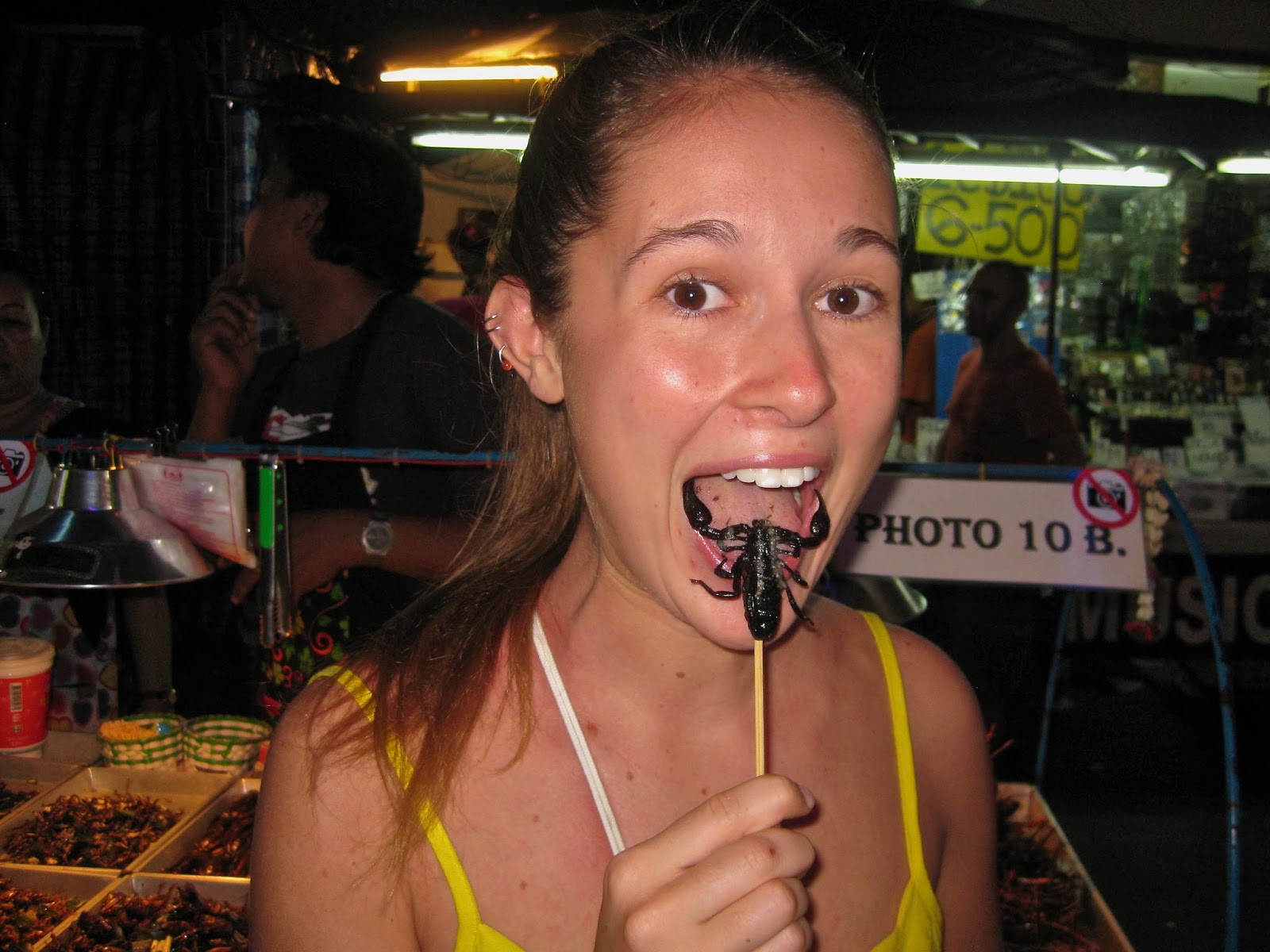 Me eating a fried scorpion in Bangkok, Thailand.