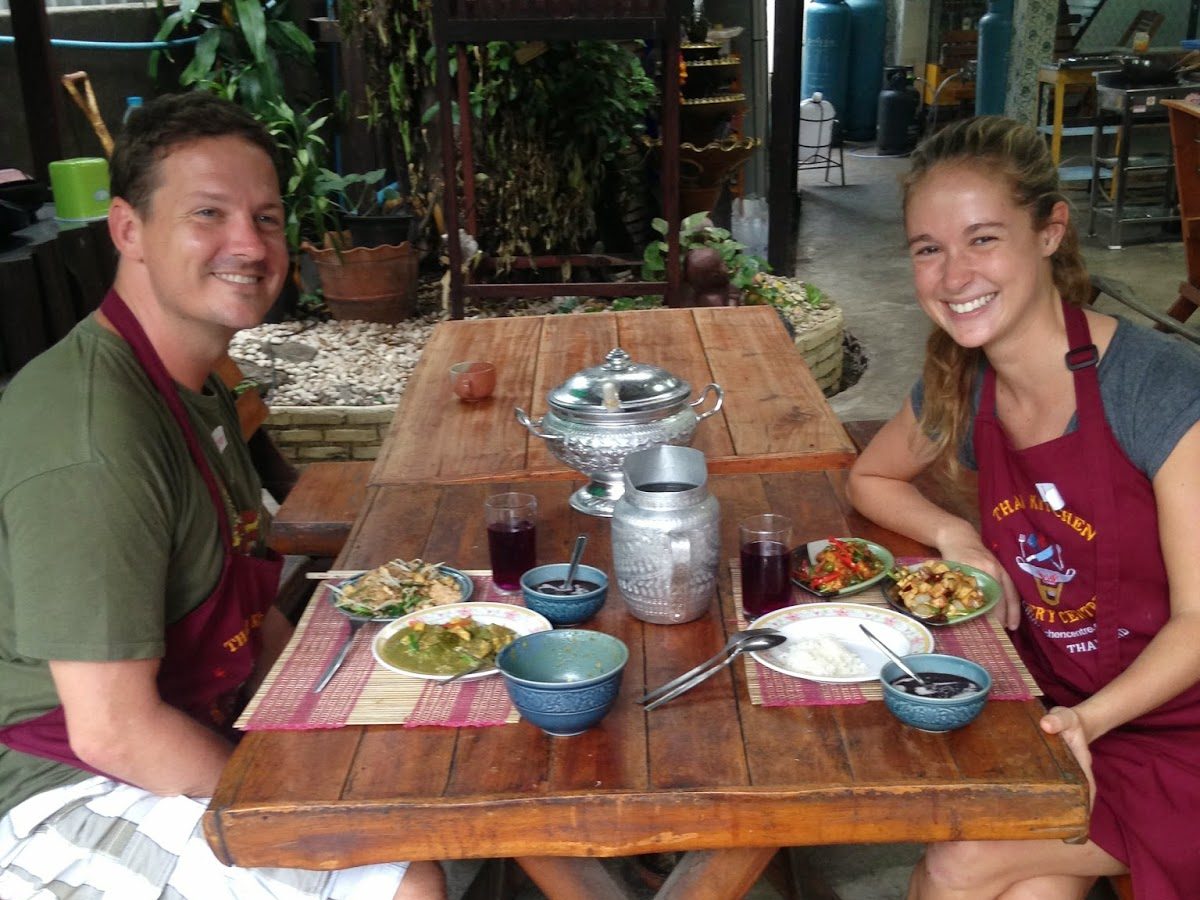 Fletch and me enjoying the meal we just cooked at a cooking school in Chiang Mai, Thailand