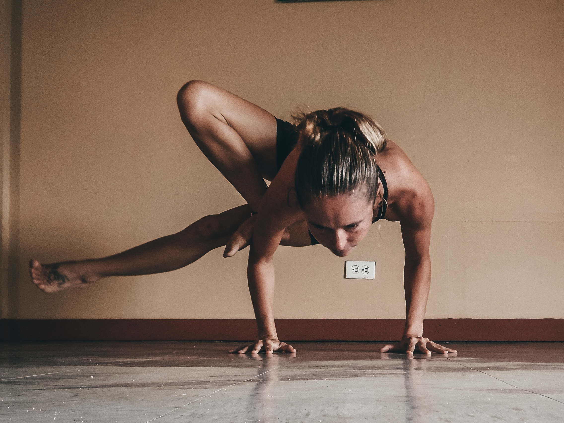 me practicing grasshopper pose