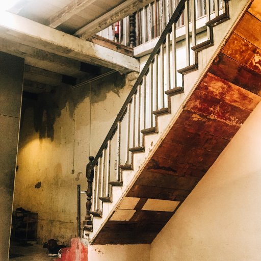 The old wooden staircase leading up to the second floor.