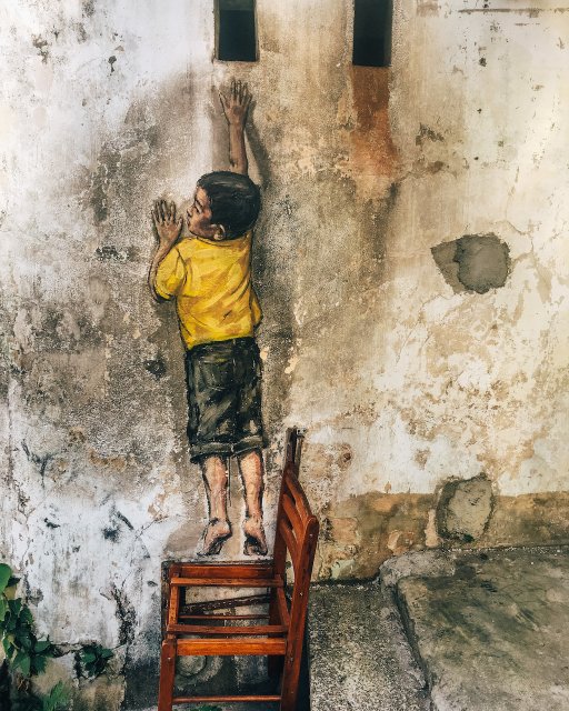 Boy on a Chair by Ernest Zacharevic
