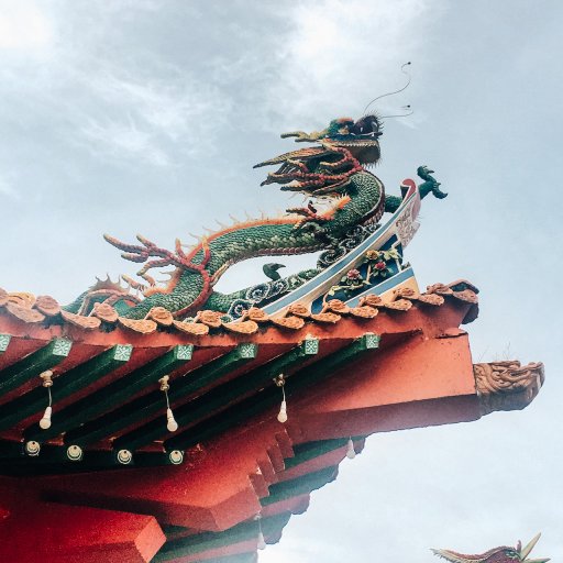 An intricate dragon guarding the corner of the roof at Thean Hou Temple.