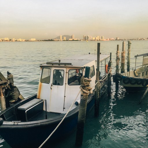 Local boats at the end of the Weld Quay Jetty.