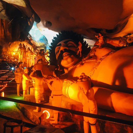 A massive Gulliver of a man inside the Ramayana cave.
