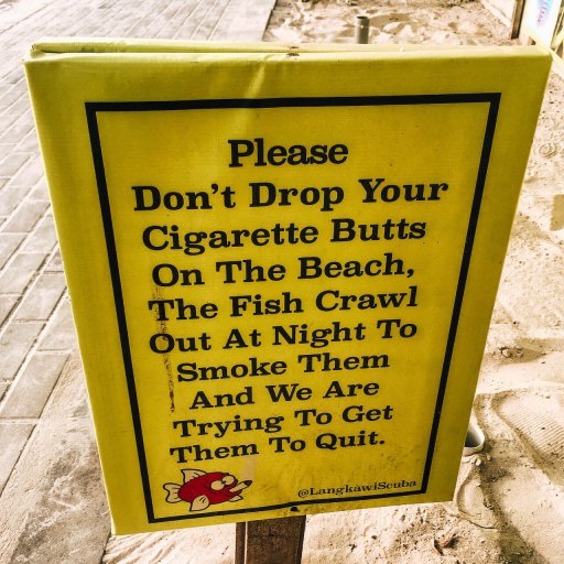 A sign on Cenang Beach trying to discourage people from dropping their cigarette butts.
