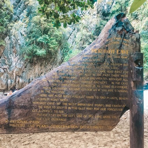 A sign details the known history of Emerald Cave.
